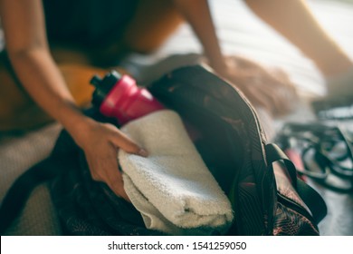 Close Up Of Woman Packing Sport Bag