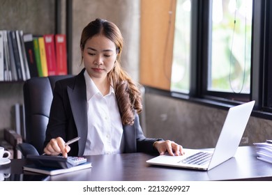 Close Up Of Woman Planning Home Budget And Using Calculator.
