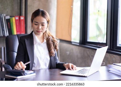 Close Up Of Woman Planning Home Budget And Using Calculator.
