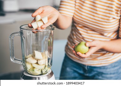 Close Up Of Woman Preparing Banana Smoothie.