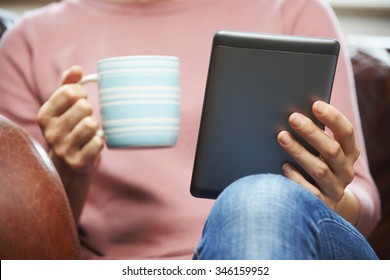 Close Up Of Woman Reading E Book