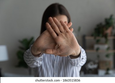 Close up of woman show stop gesture or sign say no to abuse or domestic violence. Confident determined female protest against discrimination or abortion. Nonverbal communication concept. - Powered by Shutterstock