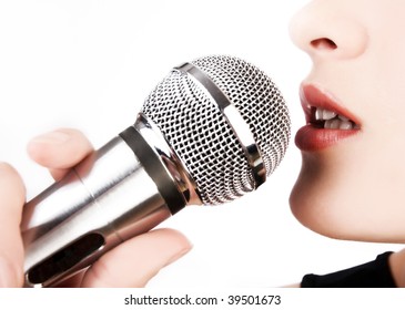 Close Up Of Woman Singing Into Microphone