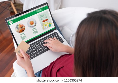 Close Up Woman Sitting Use Credit Card Pay For Food Online Order On Laptop Computer In Add To Cart Function Webpage At Home,Digital Marketing Concept.digital Lifestyle Living