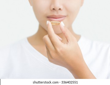 Close Up Woman Taking Vitamin Capsule For Healthy