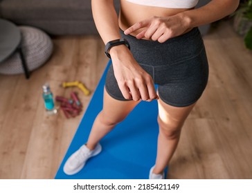 Close Up Of A Woman Touching Fitness Watch Tracking Exercise Post Work Out