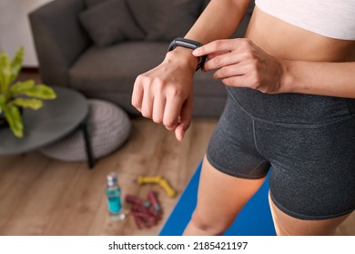 Close Up Of A Woman Touching Fitness Watch Tracking Exercise Post Work Out