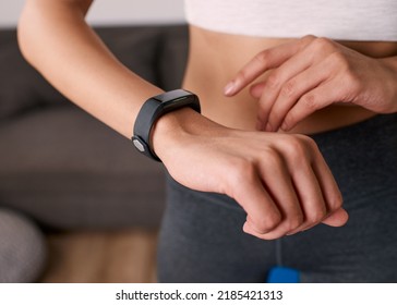 Close Up Of A Woman Touching Fitness Watch Tracking Exercise Post Work Out