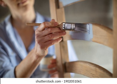 Close Up Of Woman Upcycling Furniture In Workshop At Home Painting Wooden Chair    - Powered by Shutterstock