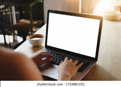 Close up of woman using blank laptop order products  for shopping online within the cafe.