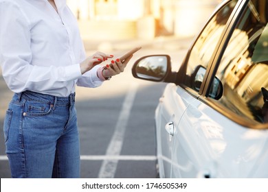 Close Up Woman Using Mobile Phone, Communication Or Online Application, Standing Near Car On City Street Or Parking, Outdoors. Car Sharing, Rental Service Or Taxi App. 