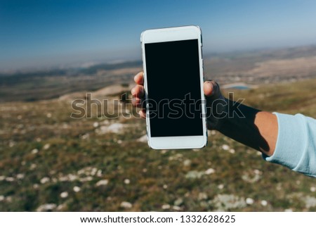 Close up of a woman using mobile smart phone outdoor