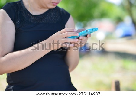 Close up of a Woman using mobile smart phone