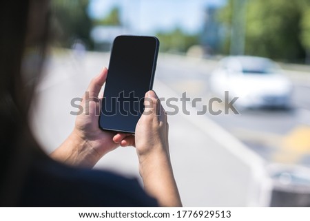 close up of woman using smartphone