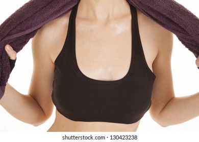 A Close Up Of A Woman's Chest With Sweat Dripping Of Of It.