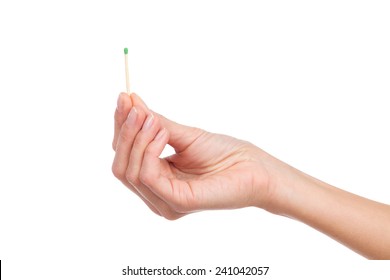 Close Up Of Woman's Hand Holding A Match. Studio Shot Isolated On White.