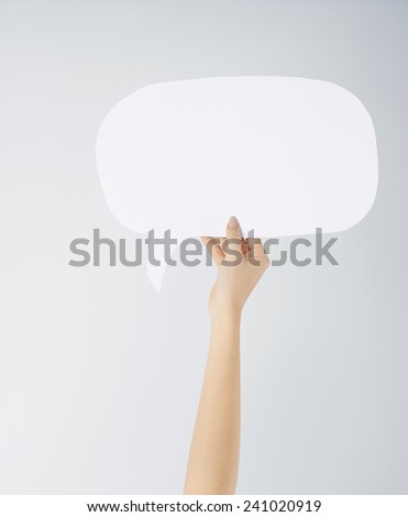 Close up of woman's hand with speech bubble