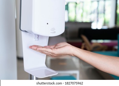 Close up of woman's hand using alcohol gel disinfecting hands. Cleaning, washing hands using automatic sanitizer dispenser concept. - Powered by Shutterstock