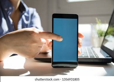 Close up of woman's hands using smart phone touchscreen
