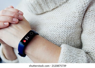 Close Up Of A Woman's High Heart Rate Fitness Tracker. Tachycardia After Coronavirus. Selective Focus.