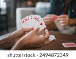 Close up of women hand hold and play card