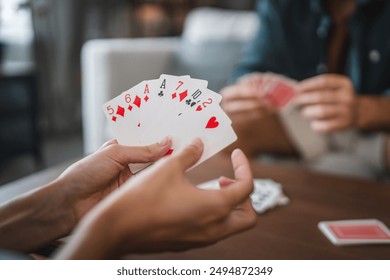 Close up of women hand hold and play card - Powered by Shutterstock