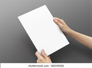 Close Up Women Hands Holding Paper Blank A5 Size For Design Paper On Dark Grey Background.