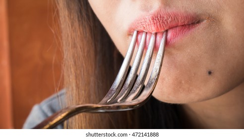 Close Up Women Mouth Eating With 
Spoon In  Restaurant.