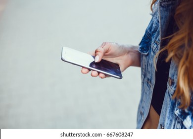 Close Up Of Women's Hands Holding Cell Telephone With Blank Copy Space Scree For Your Advertising Text Message Or Promotional Content, Hipster Girl Watching Video On Mobile Phone During Coffee Break