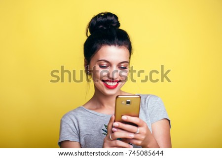 Close up of women's hands holding cell telephone with blank copy space scree for your advertising text message or promotional content, hipster girl watching video on mobile phone during coffee break