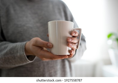 Close Up Of Women's Hands Holding White Mug With Blank Copy Space Scree For Your Advertising Text Message Or Promotional Content, Sweet Coffee Or Tea.