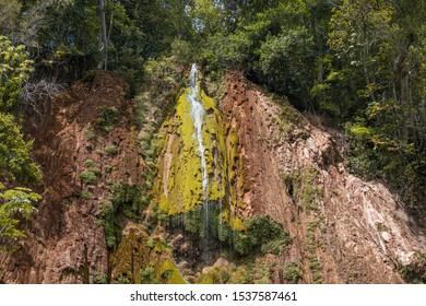 Close Up Of The Wonderful El Limon Tropical Waterfall With Lots Of Moss And Steaming Water, Seen From Below The Waterfall In The Dominican Republic Of The Samaná Peninsula.
