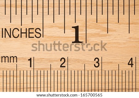 Close up of a wood ruler showing a one inch measurement.