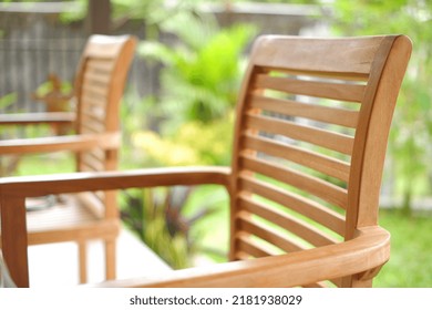 close up of wooden chairs on the terrace suitable for furniture ideas. selective focus wooden chair garden grasshopper background