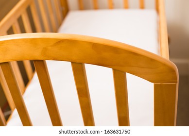 Close Up Of A Wooden Cot Frame For A New Baby