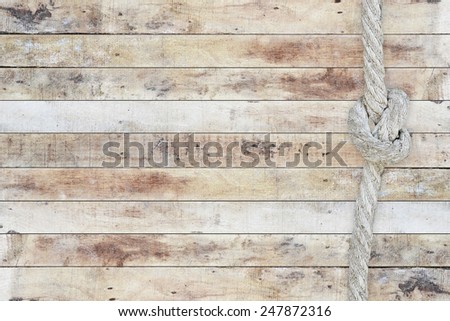 Close up of wooden panels with knot rope