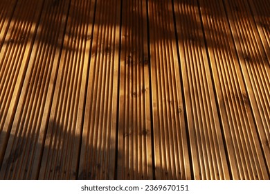 Close up of wooden pieces of decking with ridged texture. Wooden decking in England.  - Shutterstock ID 2369670151
