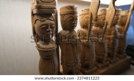 Close up of wooden statues of ethnic figure for decoration