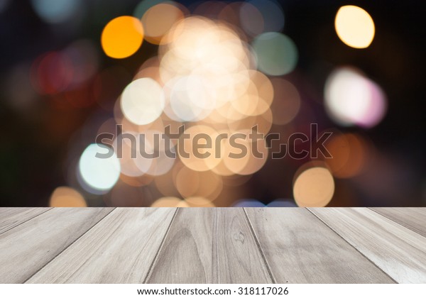 Close up\
wooden table with light blurred\
background
