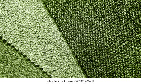 close up wool fabric drapery swatch showing in green olive color tone. macro view of fabric curtain sample palette for interior material. vintage style drapery catalog swatch.