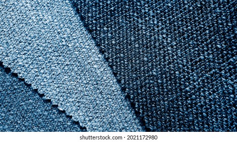 close up wool fabric drapery swatch showing in blue color tone. macro view of fabric curtain sample palette for interior material. vintage style drapery catalog swatch.
