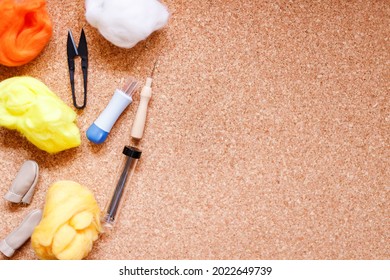 Close Up Of Wool Needle Felting Kit On Cork Surface.