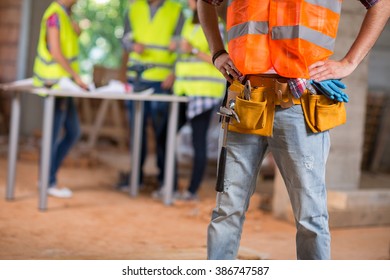Close up of worker's belt with tools