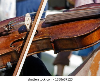 Close Up Of Worn Fiddle Being Playing At Bluegrass Festival.