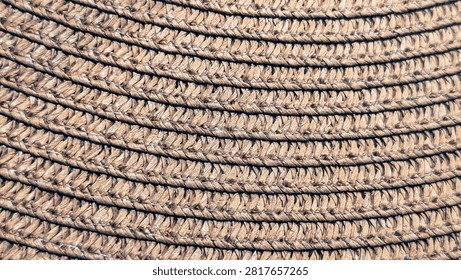close up of woven straw hat texture with braided circular rows