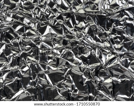 Close up of wrinkle silver foil as background. Freud sheet.