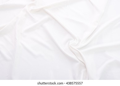 Close Up Of Wrinkled White Color Fabric Bed Sheet Texture Background.