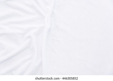 Close Up Of Wrinkled White Color Fabric Bed Sheet Texture Background.