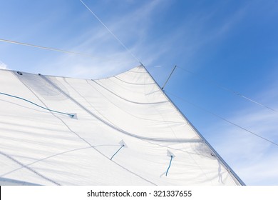 Close up of yacht mast and sail on sky background. Sailing boat part. - Powered by Shutterstock