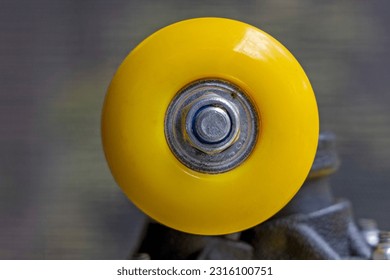 Close up of a yellow skateboard wheel - Powered by Shutterstock